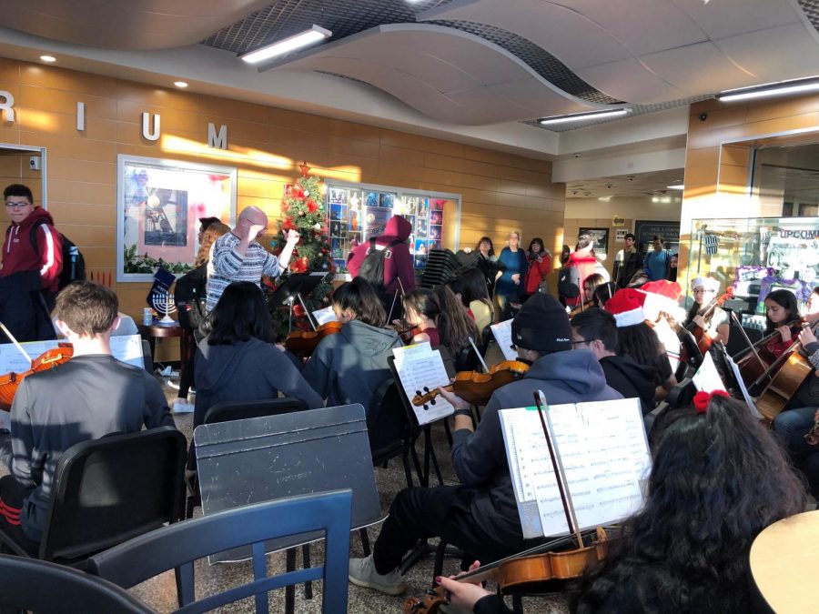 Mr. Stein leads the orchestra in the lobby. 